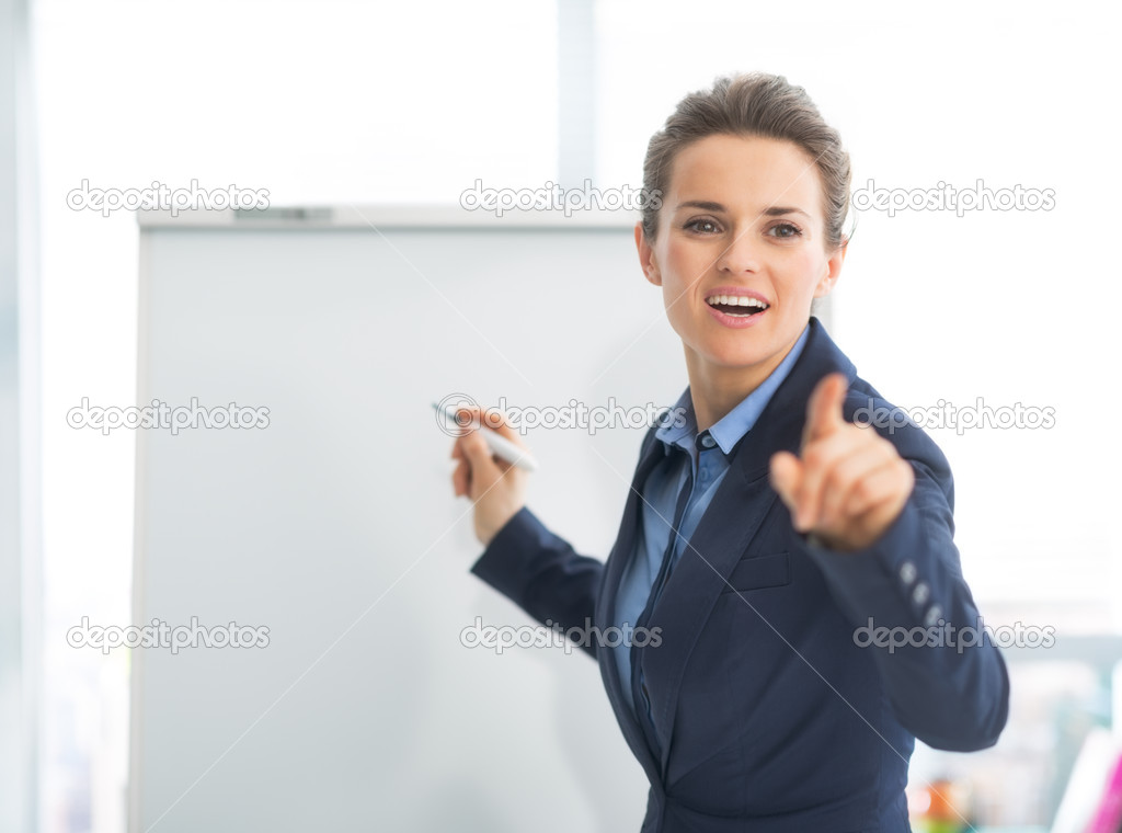 Business woman pointing on listener