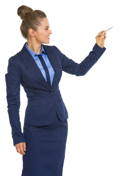 Business woman writing in air with pen — Stock Photo, Image