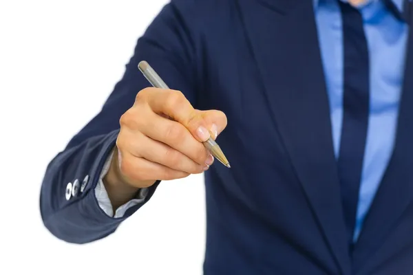 Business woman writing in air with pen — Stock Photo, Image