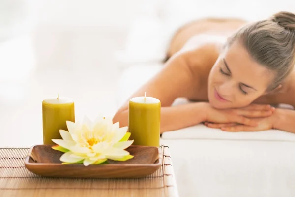Spa young woman laying on massage table — Stock Photo, Image