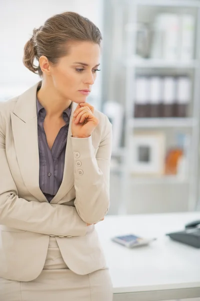 Thoughtful business woman in office — Stock Photo, Image