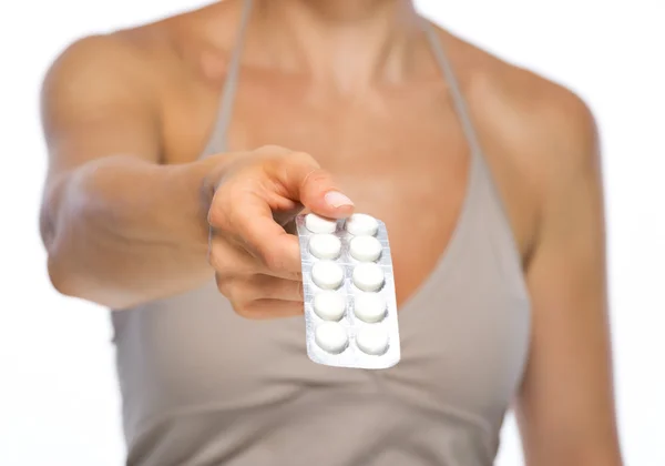 Woman giving blistering package of pills — Stock Photo, Image