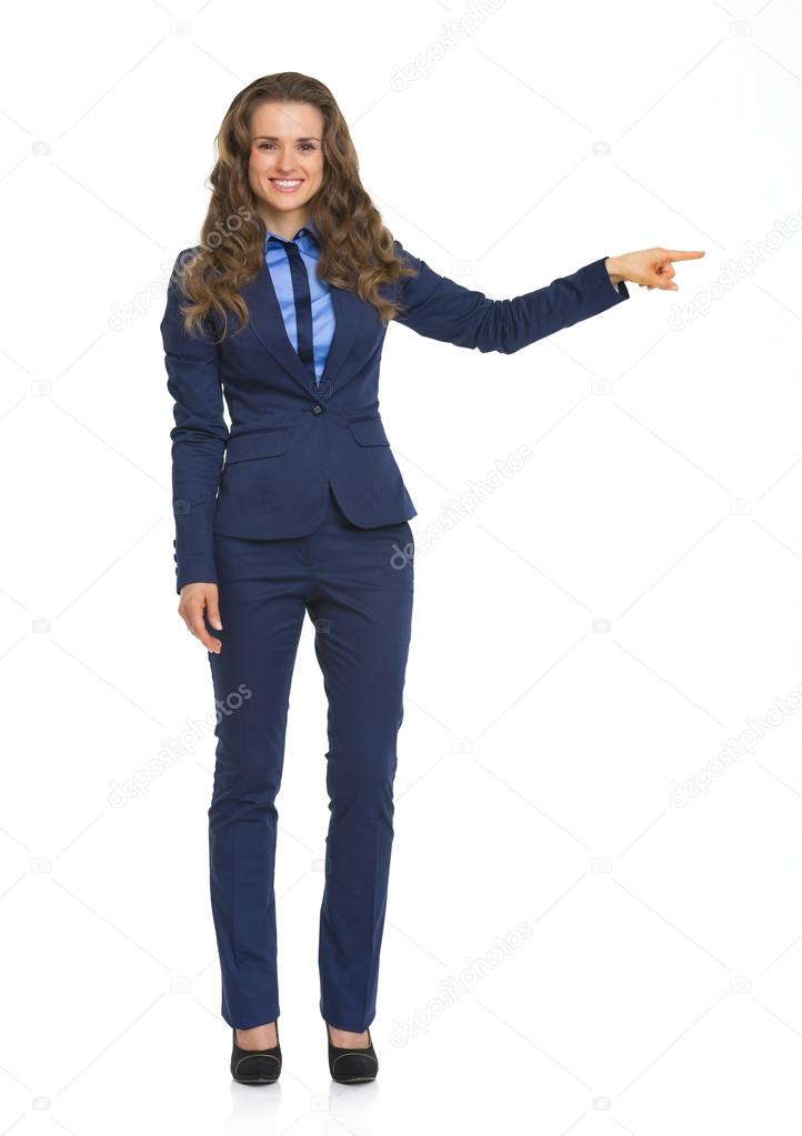 Business woman pointing on copy space