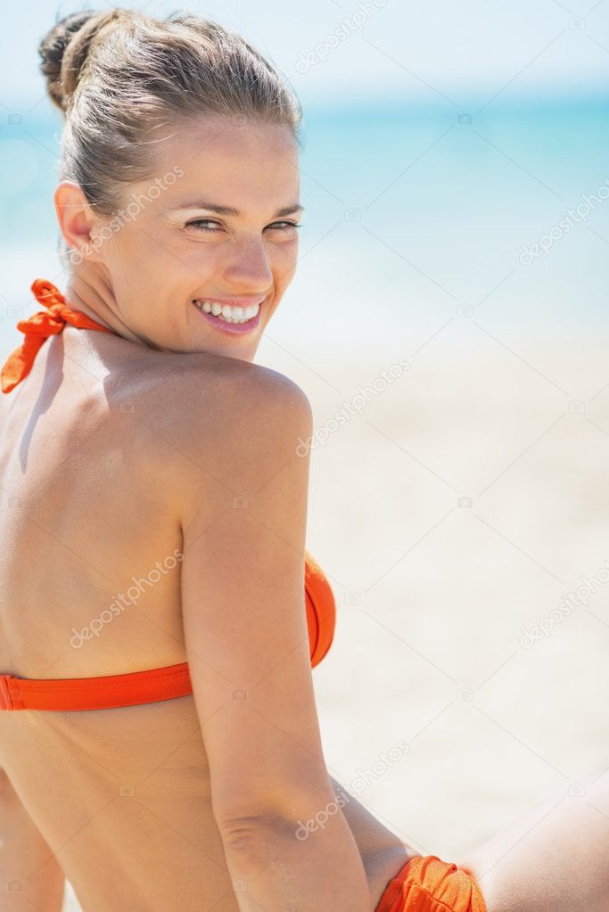 Happy young woman on beach