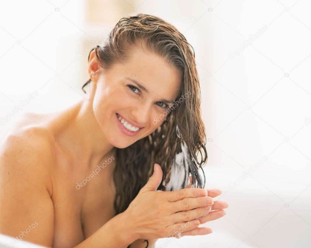 Woman applying hair conditioner