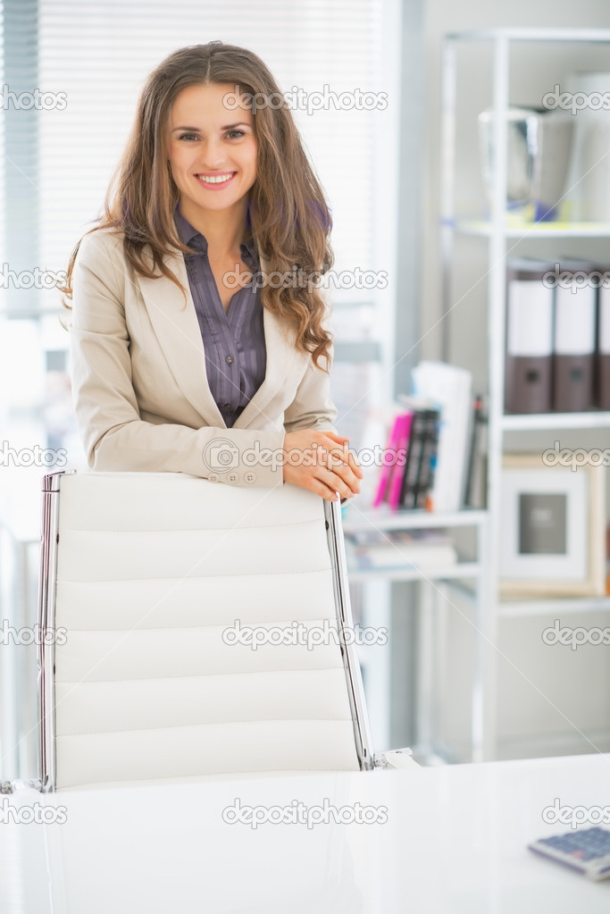 Happy business woman in office