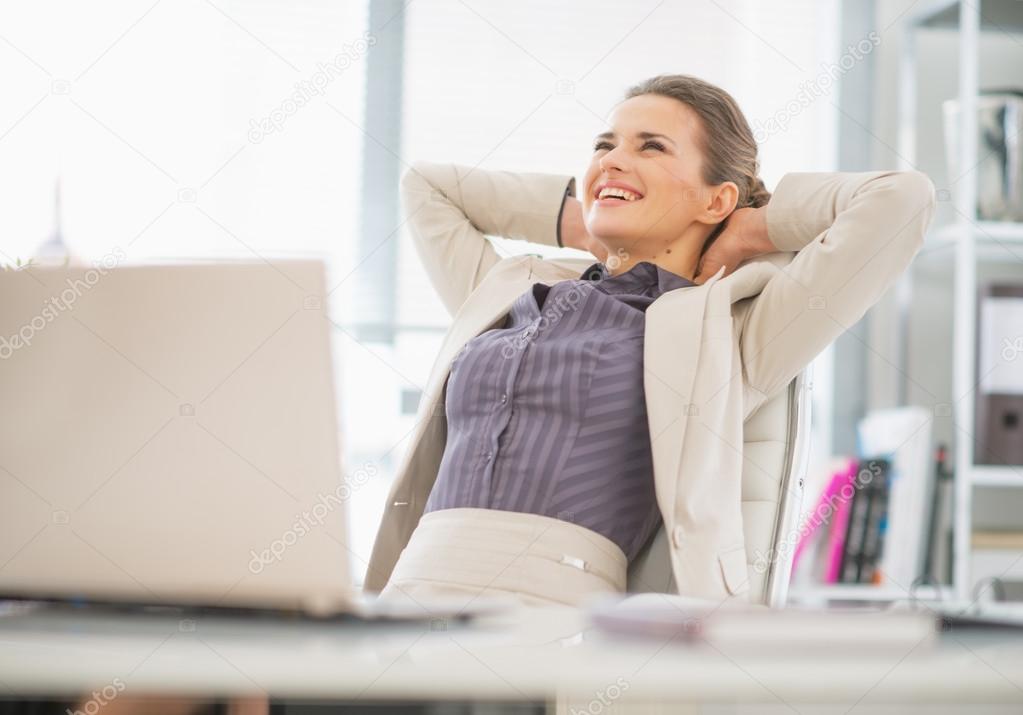 Relaxed business woman in office