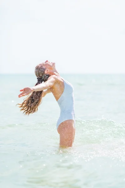 Woman in swimsuit rejoicing — Stock Photo, Image