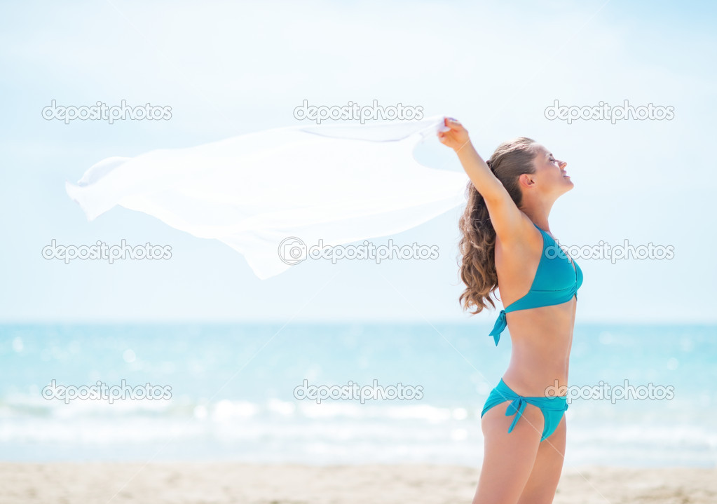 Woman with pareo on beach