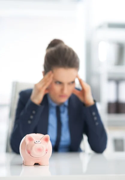 Piggy bank and businesswoman — Stock Photo, Image