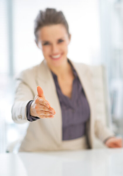 Business woman stretching hand