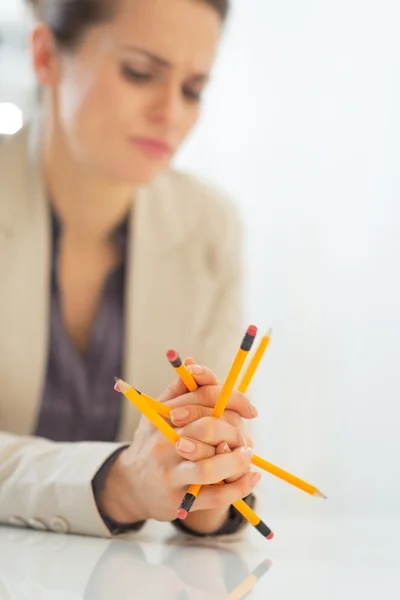 Business woman holding pencils — Stock Photo, Image