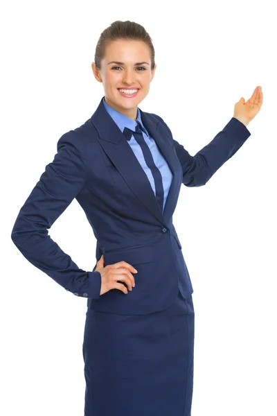 Happy business woman pointing on copy space — Stock Photo, Image