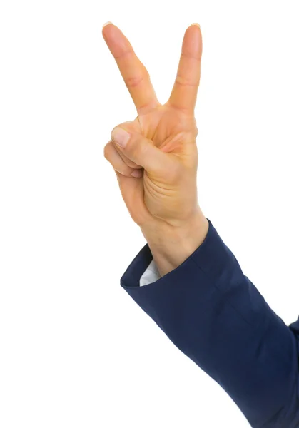 Businesswoman showing victory gesture — Stock Photo, Image