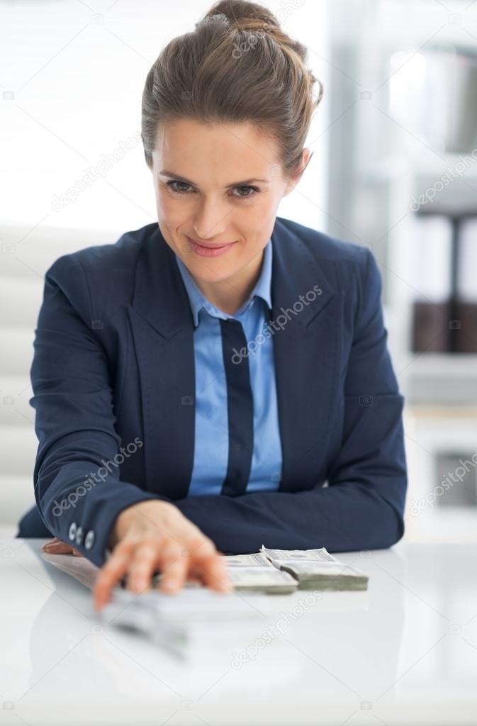 Business woman giving money
