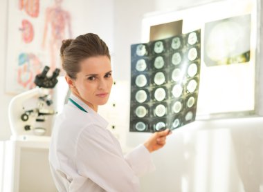 Portrait of medical doctor woman with tomography clipart