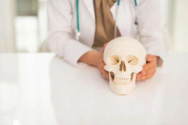 Doctor holding human skull — Stock Photo, Image