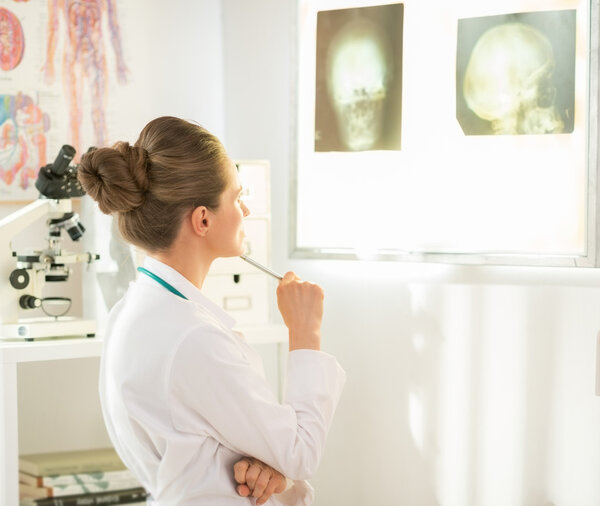 Doctor woman looking on fluorography