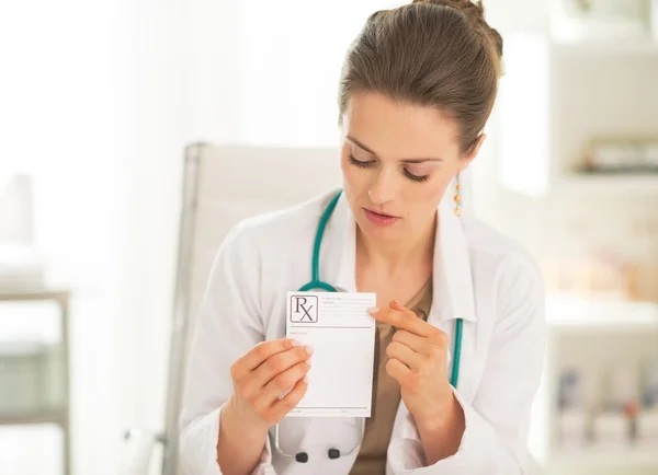 Doctor woman pointing on prescription — Stock Photo, Image