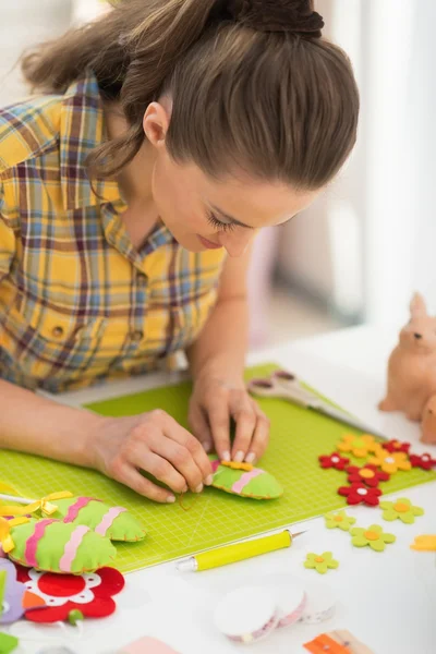 Woman making easter decoration