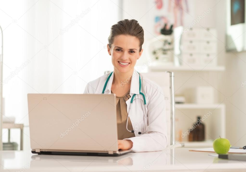 Doctor working on laptop