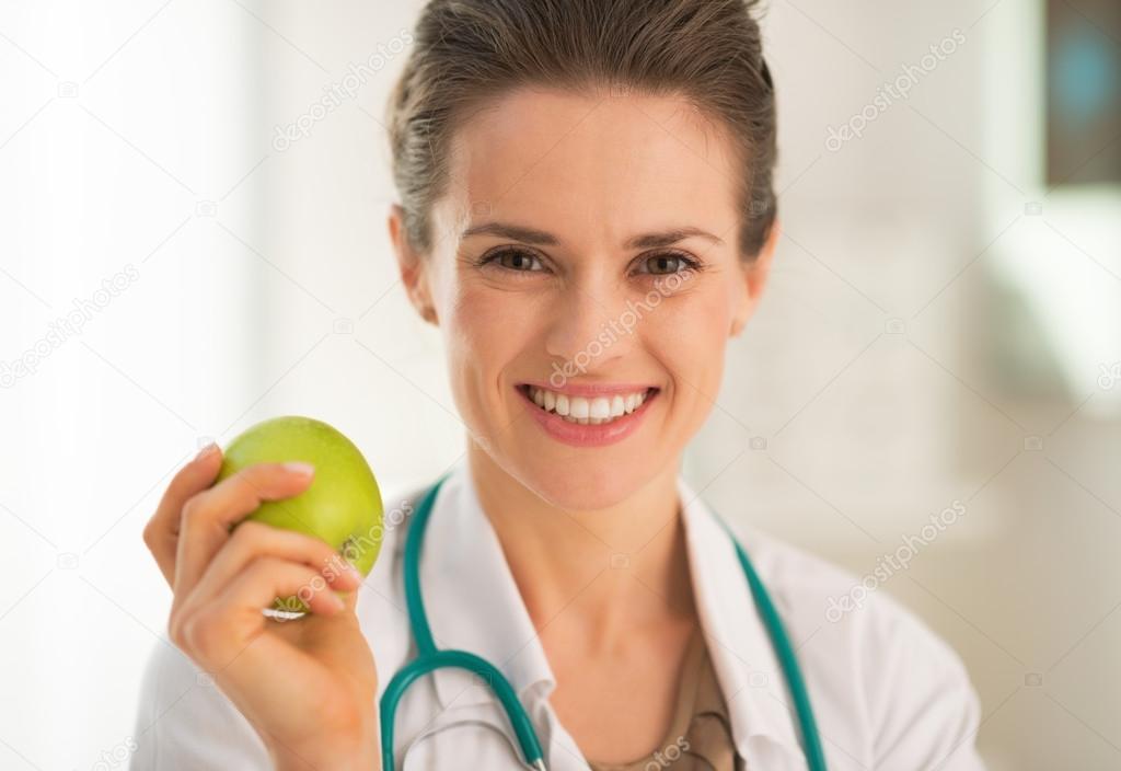 Medical doctor woman with apple