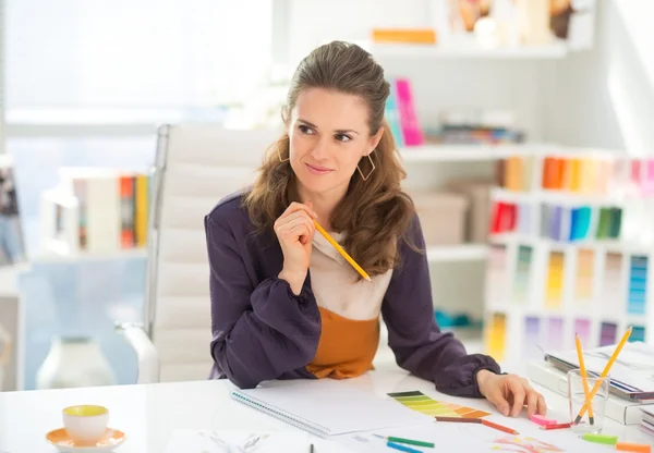 Thoughtful fashion designer in office — Stock Photo, Image