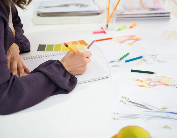 Fashion designer making sketches — Stock Photo, Image