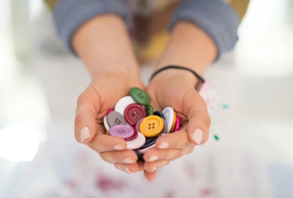 Seamstress showing buttons — Stock Photo, Image