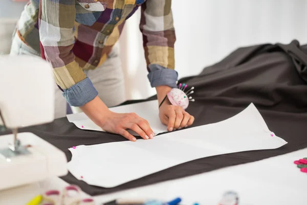 Seamstress making pattern on fabric — Stock Photo, Image