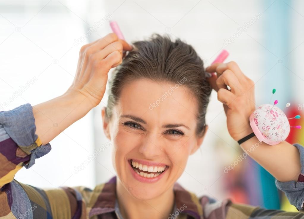 Seamstress making horns using thread