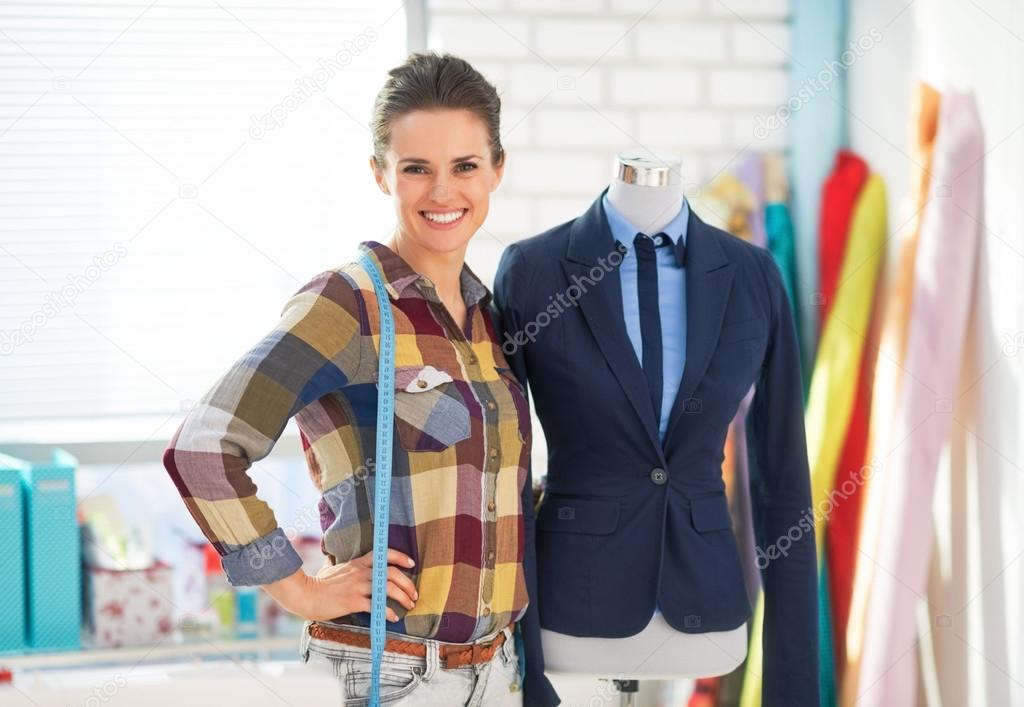 Seamstress near mannequin in suit