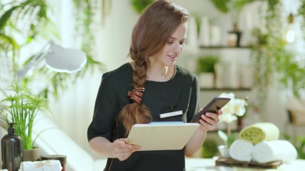 Smiling Years Old Woman Worker Clipboard Smartphone Modern Beauty Studio — Stock Video