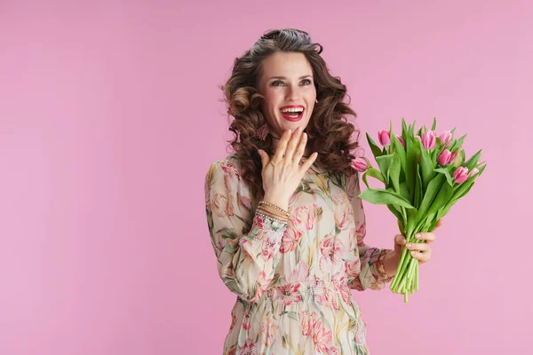 Happy Modern Middle Aged Woman Floral Dress Tulips Bouquet Jumping — Stockfoto