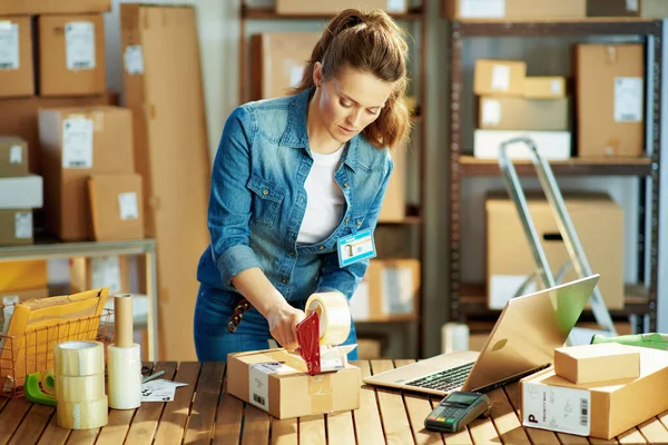 Delivery Business Young Woman Jeans Parcels Packing Tape Dispenser Warehouse — Stok fotoğraf