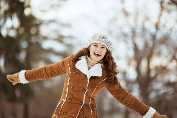 Smiling Modern Middle Aged Woman Mittens Knitted Hat Sheepskin Coat — Fotografia de Stock