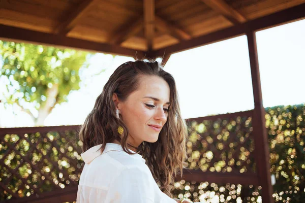 Pensive Elegant Middle Aged Woman White Shirt Patio — Fotografia de Stock