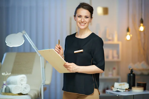 Smiling Female Worker Clipboard Modern Beauty Studio — Foto de Stock