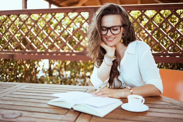 Smiling Elegant Woman White Shirt Cup Coffee Eyeglasses Sitting Table — 图库照片