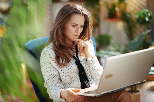Green Home Pensive Stylish Housewife Long Wavy Hair Laptop Sitting — Stockfoto
