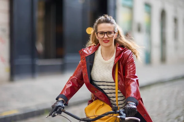 Smiling Elegant Woman Red Rain Coat Outdoors City Street Riding — Fotografia de Stock