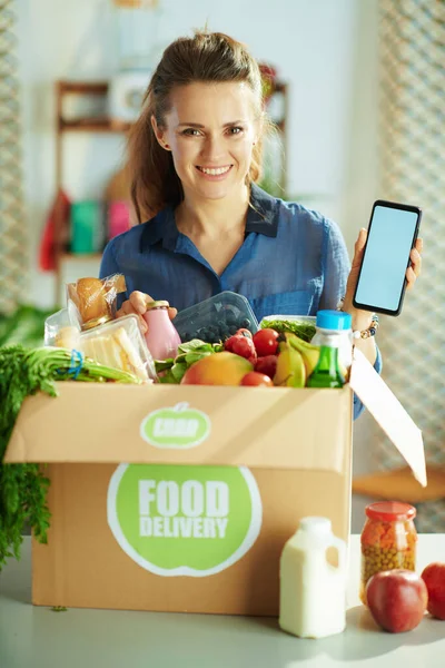 Food Delivery Happy Young Female Food Box Showing Smartphone Blank — Foto de Stock