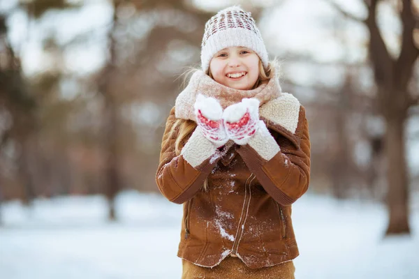 Smiling Modern Girl Mittens Knitted Hat Sheepskin Coat Playing Outdoors — Stock Photo, Image