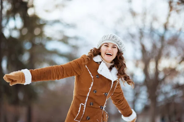 Happy Stylish Woman Mittens Knitted Hat Sheepskin Coat Rejoicing Outdoors — 图库照片