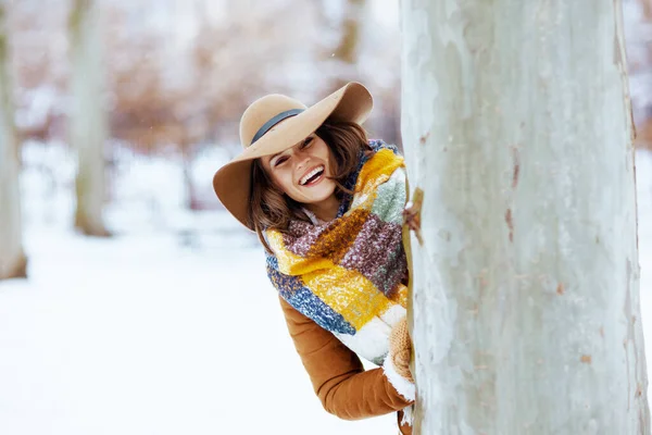 Smiling Stylish Woman Brown Hat Scarf Mittens Sheepskin Coat Tree — Fotografia de Stock