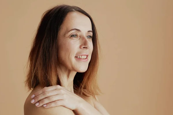 happy modern woman with short hair isolated on beige.