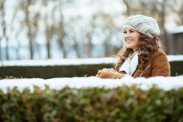 Happy Modern Middle Aged Woman Mittens Knitted Hat Sheepskin Coat — Zdjęcie stockowe