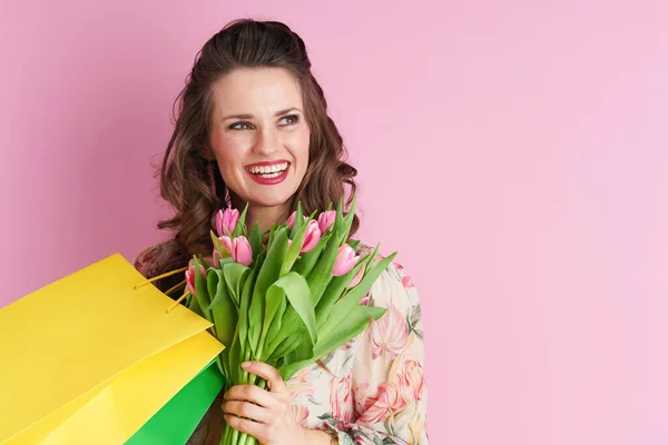 Smiling Trendy Female Floral Dress Tulips Bouquet Shopping Bags Isolated — Stok fotoğraf