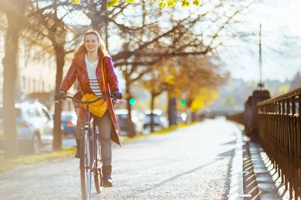 Smiling Modern Woman Red Rain Coat City Street Riding Bicycle — Fotografia de Stock