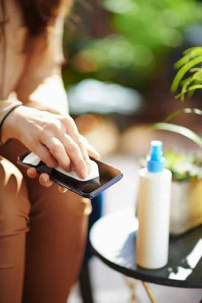 Green Home Closeup Female Home Sunny Day Disinfecting Smartphone — Stockfoto